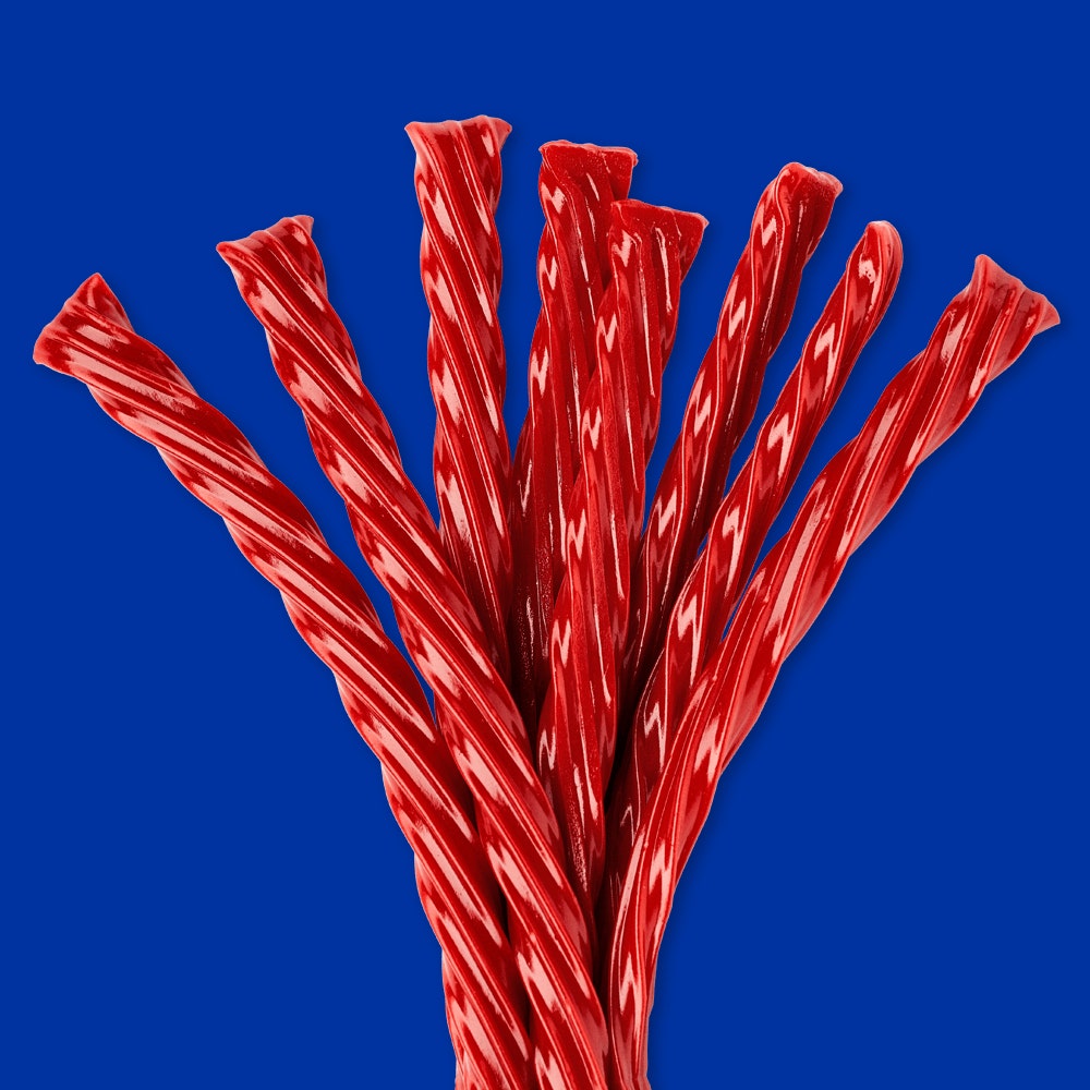 a handful of twizzlers strawberry twists candy
