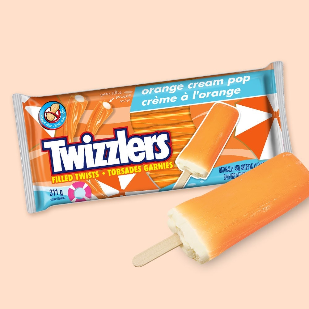 Sac de torsades garnies TWIZZLERS à la crème à l’orange avec une sucette glacée